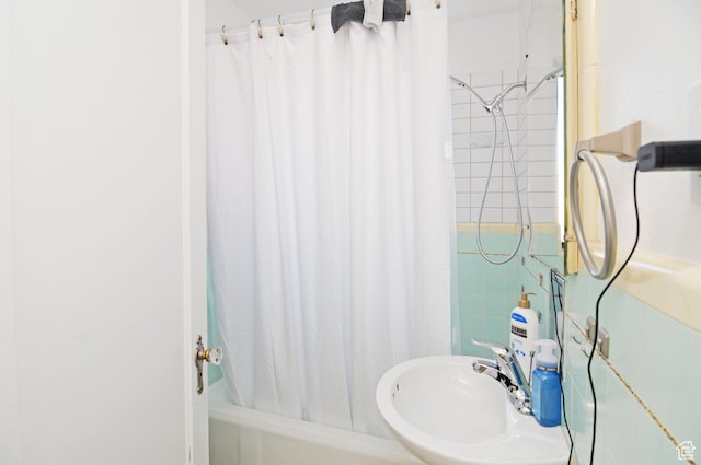 bathroom with a sink and shower / bath combo