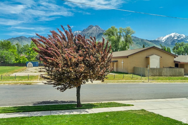 view of road featuring a mountain view and sidewalks