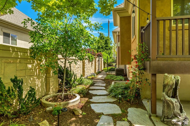fenced backyard with central AC unit