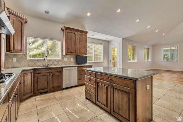 kitchen featuring a sink, appliances with stainless steel finishes, backsplash, recessed lighting, and ventilation hood