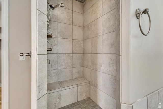 bathroom with a shower stall