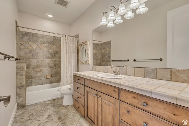full bathroom featuring shower / bathtub combination with curtain, toilet, vanity, and tile patterned flooring