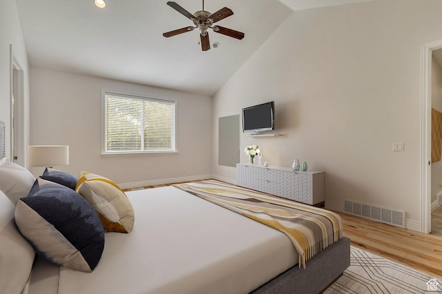 bedroom featuring wood finished floors, baseboards, high vaulted ceiling, and ceiling fan