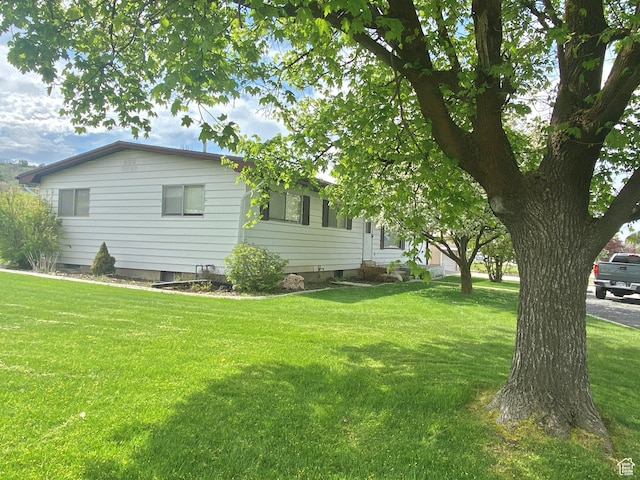 105 S 200 E, Richmond, UT 84333 - view of side of property featuring a yard