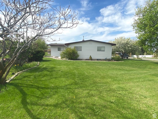 105 S 200 E, Richmond, UT 84333 - view of side of home with a yard