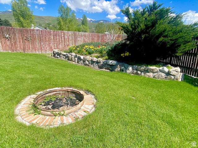 105 S 200 E, Richmond, UT 84333 - view of yard with an outdoor fire pit and a mountain view