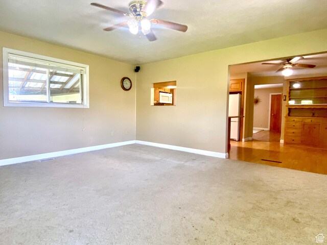 105 S 200 E, Richmond, UT 84333 - carpeted empty room with ceiling fan and baseboards