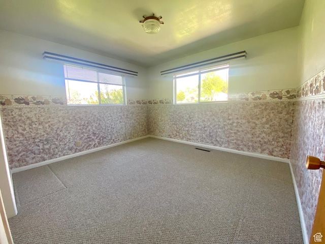 105 S 200 E, Richmond, UT 84333 - spare room with plenty of natural light and carpet flooring
