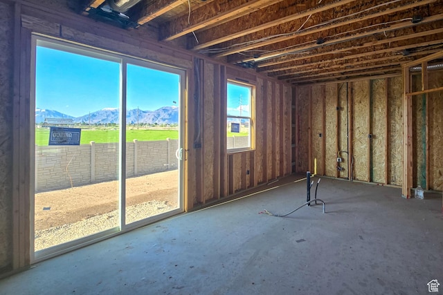miscellaneous room with a mountain view