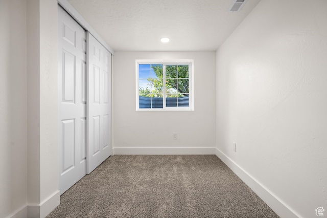 850 E Village Rd N, Ogden, UT 84404 - unfurnished bedroom featuring carpet flooring, baseboards, and a closet