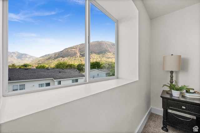 850 E Village Rd N, Ogden, UT 84404 - detailed view of a mountain backdrop, baseboards, and carpet flooring