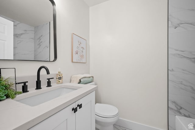 850 E Village Rd N, Ogden, UT 84404 - full bath featuring marble look tiles, toilet, vanity, baseboards, and a shower