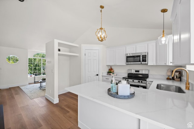 850 E Village Rd N, Ogden, UT 84404 - kitchen featuring appliances with stainless steel finishes, a sink, white cabinets, lofted ceiling, and light stone counters