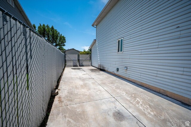 850 E Village Rd N, Ogden, UT 84404 - view of property exterior with a gate and a patio area