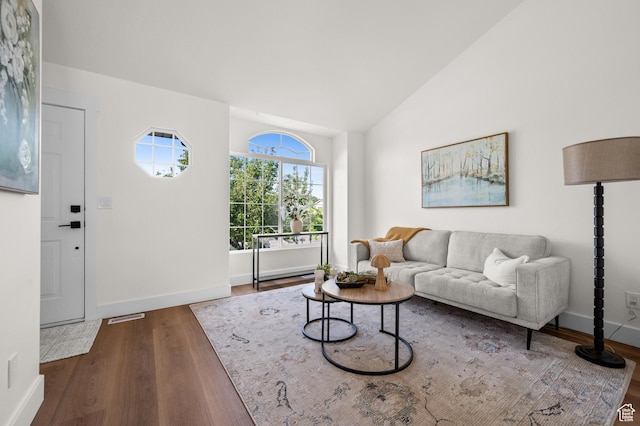 850 E Village Rd N, Ogden, UT 84404 - living area with wood finished floors, lofted ceiling, and baseboards