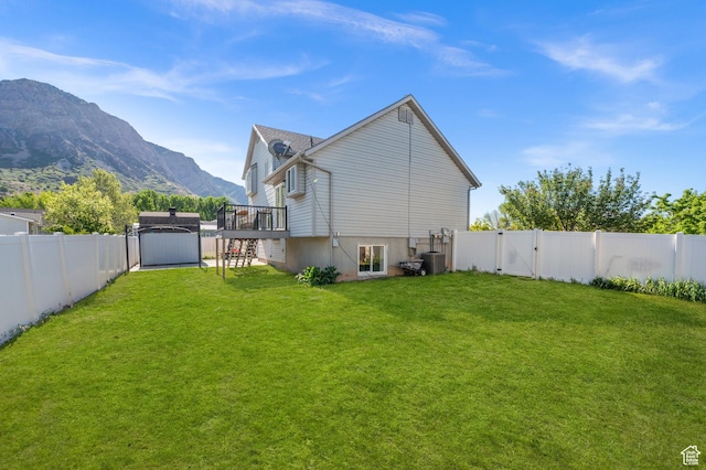 850 E Village Rd N, Ogden, UT 84404 - back of property featuring a deck with mountain view, a gate, and stairs