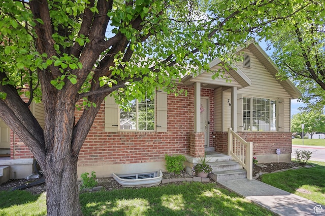 view of front of home with brick siding