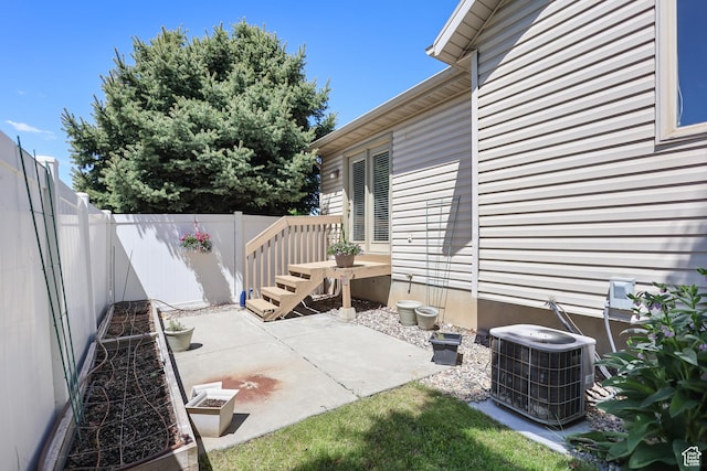 view of patio / terrace featuring central AC and a fenced backyard