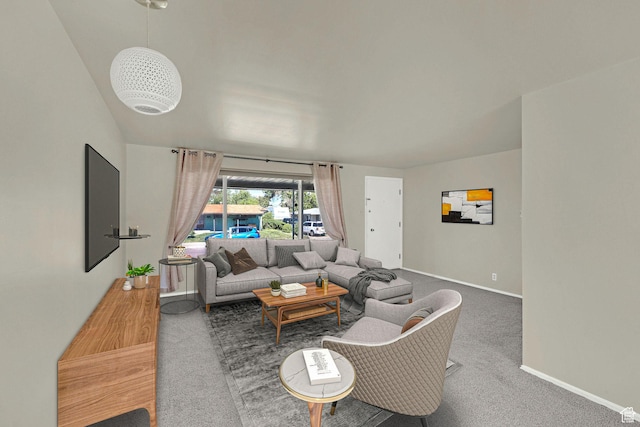 carpeted living area featuring baseboards