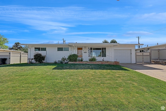 ranch-style home featuring an attached garage, driveway, and a gate