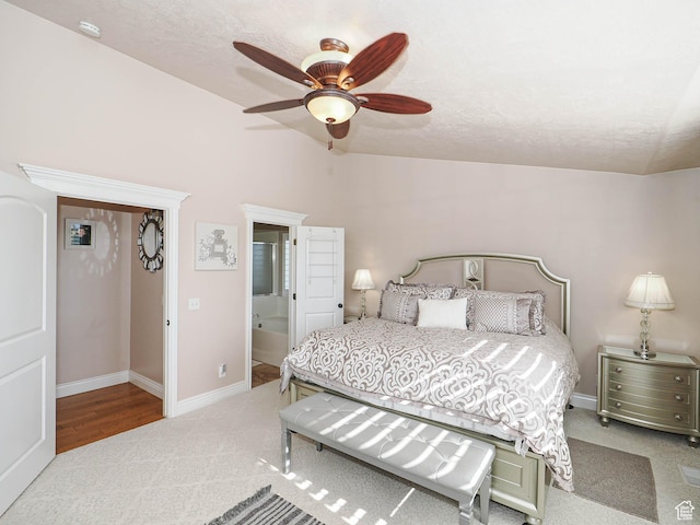 7956 S Cricket Ln W, West Jordan, UT 84081 - carpeted bedroom with lofted ceiling, a ceiling fan, baseboards, a textured ceiling, and ensuite bathroom