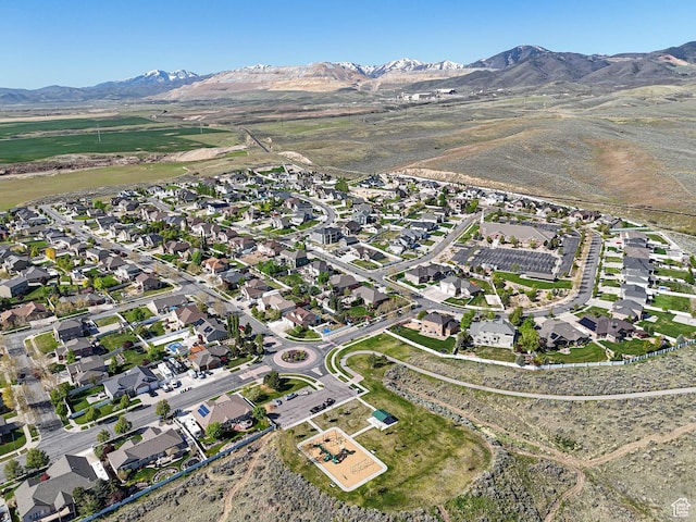 7956 S Cricket Ln W, West Jordan, UT 84081 - aerial view of property and surrounding area featuring mountains and nearby suburban area