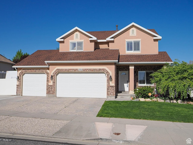 7956 S Cricket Ln W, West Jordan, UT 84081 - view of front of home with concrete driveway, stucco siding, and an attached garage