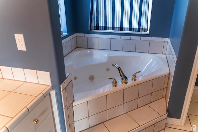 full bathroom with a whirlpool tub and tile patterned floors