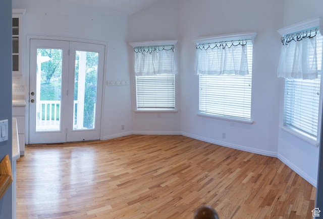 interior space with light wood-type flooring and baseboards