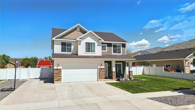 craftsman inspired home with stone siding, concrete driveway, a garage, board and batten siding, and a gate