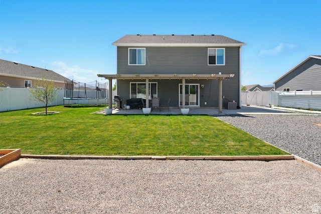 back of house with a trampoline, a patio, and cooling unit