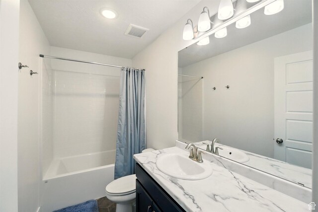 bathroom with toilet, shower / bath combo, and vanity