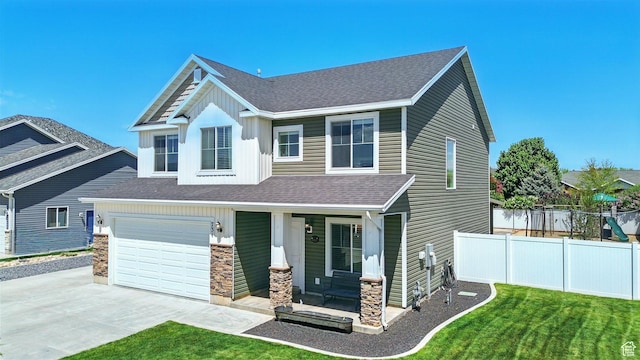 craftsman house with stone siding, driveway, a shingled roof, covered porch, and an attached garage