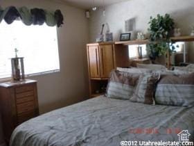 bedroom featuring multiple windows