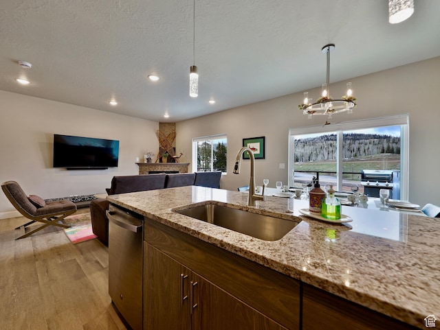 310 N N Hwy Unit 22A, Brian Head, UT 84719 - kitchen with a sink, dishwasher, a chandelier, hanging light fixtures, and open floor plan