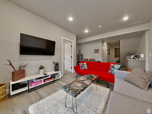310 N N Hwy Unit 22A, Brian Head, UT 84719 - living area featuring wood finished floors, recessed lighting, and baseboards