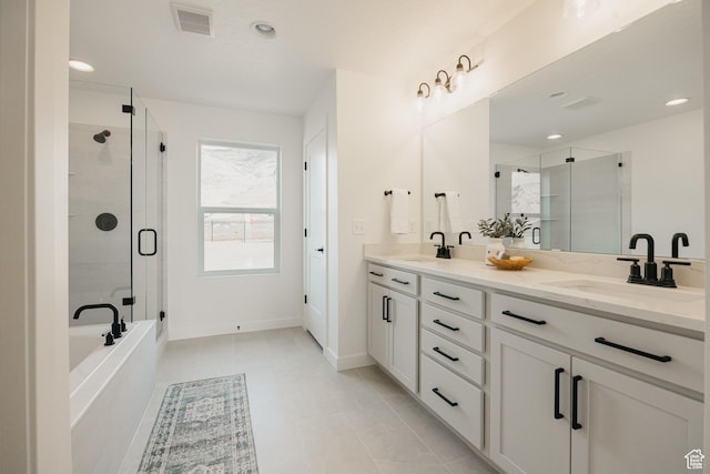 full bathroom featuring a stall shower, double vanity, a bathtub, baseboards, and recessed lighting