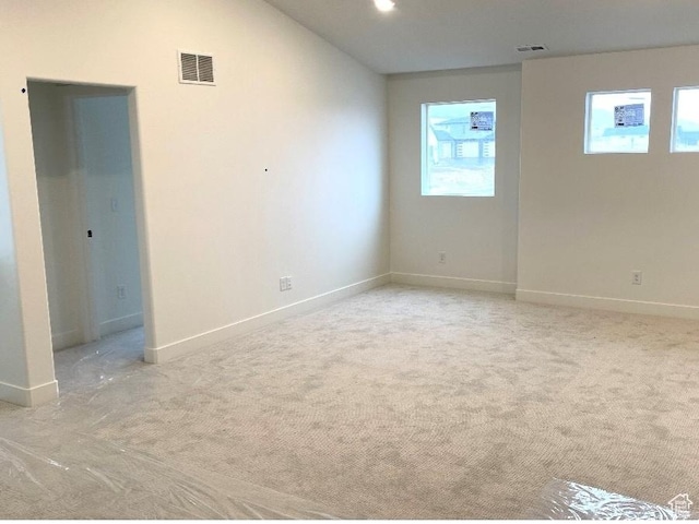 2917 E Liam Ln Unit 107, Eagle Mountain, UT 84005 - empty room with plenty of natural light and light carpet