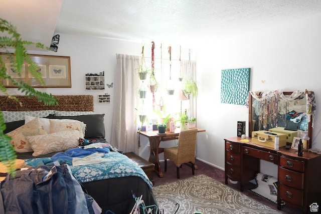 carpeted bedroom with a textured ceiling