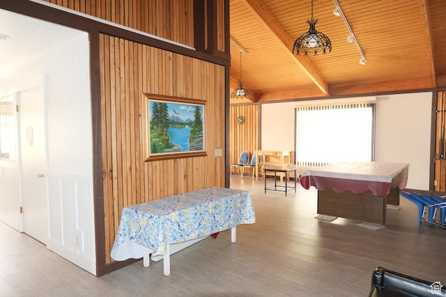 rec room featuring wood ceiling, beam ceiling, pool table, wood finished floors, and wood walls