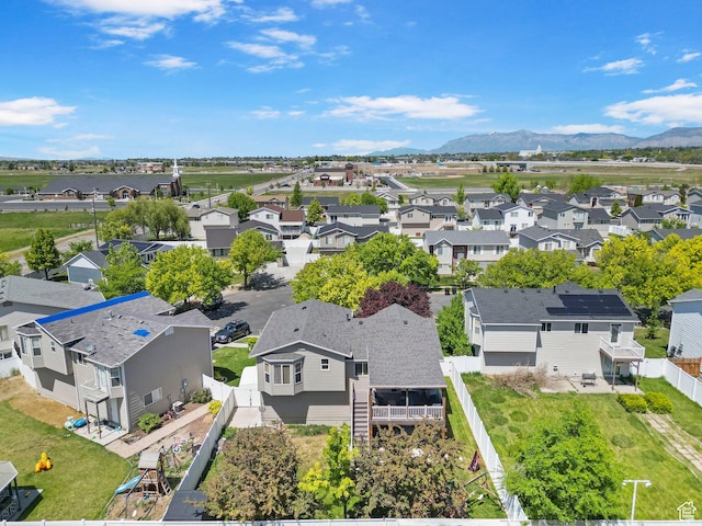 aerial perspective of suburban area with a mountainous background