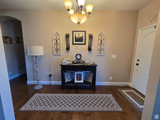 1256 Jefferson Cir, Price, UT 84501 - entryway with arched walkways, wood finished floors, and baseboards