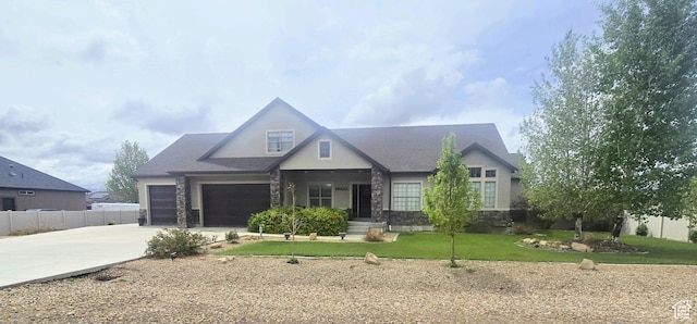 1256 Jefferson Cir, Price, UT 84501 - view of front facade with stone siding, driveway, a garage, and stucco siding
