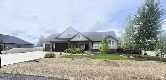 1256 Jefferson Cir, Price, UT 84501 - view of front of house featuring driveway, a garage, and stone siding