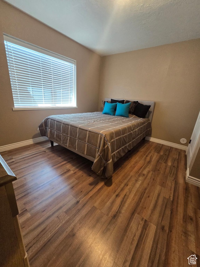 1256 Jefferson Cir, Price, UT 84501 - bedroom with baseboards and wood finished floors