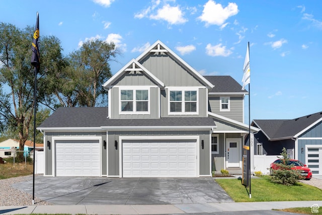 705 N Brooke Ave, Tooele, UT 84074 - view of front facade with concrete driveway, board and batten siding, a garage, and roof with shingles