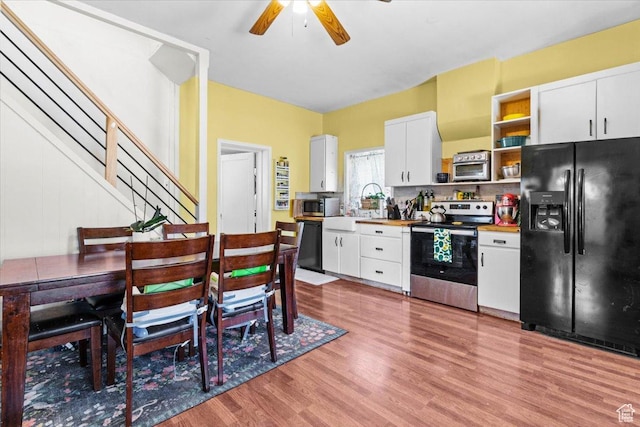193 S Main E, Manti, UT 84642 - kitchen with black appliances, open shelves, wood finished floors, a sink, and ceiling fan
