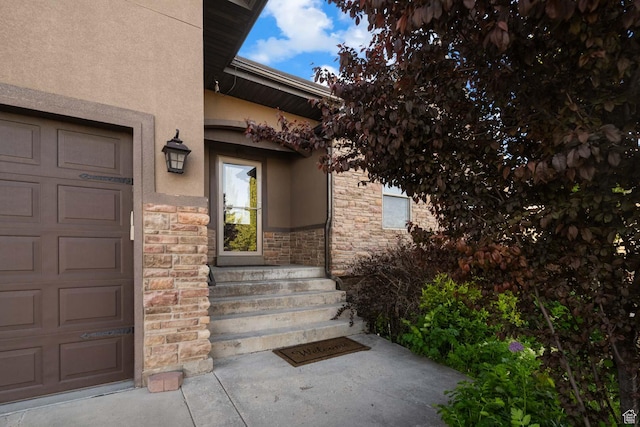 384 N 710 E, Salem, UT 84653 - doorway to property featuring stone siding, stucco siding, and a garage