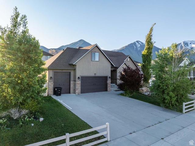 384 N 710 E, Salem, UT 84653 - view of front of home featuring stone siding, fence, driveway, and a mountain view