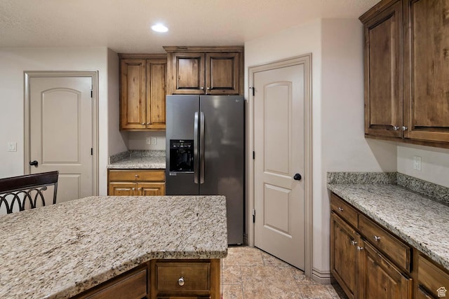 384 N 710 E, Salem, UT 84653 - kitchen featuring stainless steel fridge with ice dispenser, light stone countertops, and recessed lighting